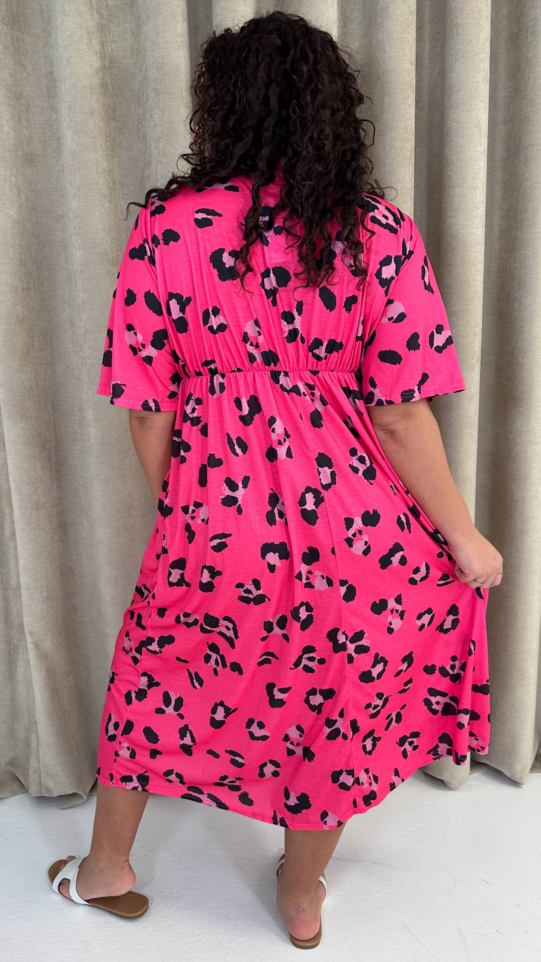 dark pink wrap midi dress in mixed print Pink & Black Geometric Print Belted Midi Dress